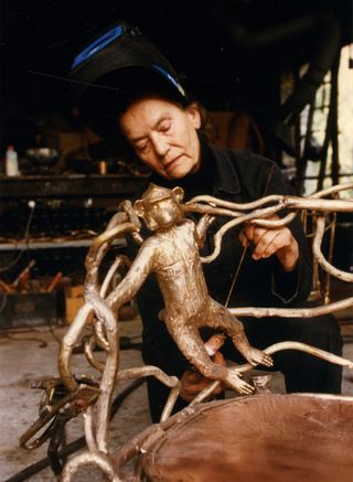Claude Lalanne working on monkey table table