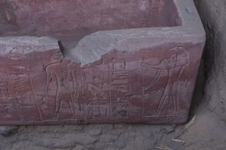 A view of the lower-right corner of the sarcophagus, on each corner an image of Thoth, the god of writing and knowledge, was shown. He has the head of an ibis bird.