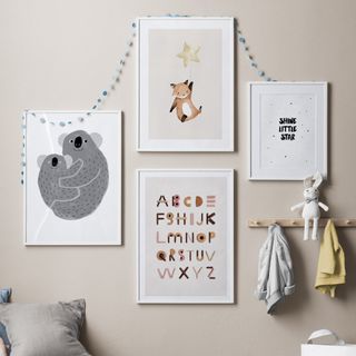 A beige-painted kids' playroom with animal and alphabet prints decorating the wall