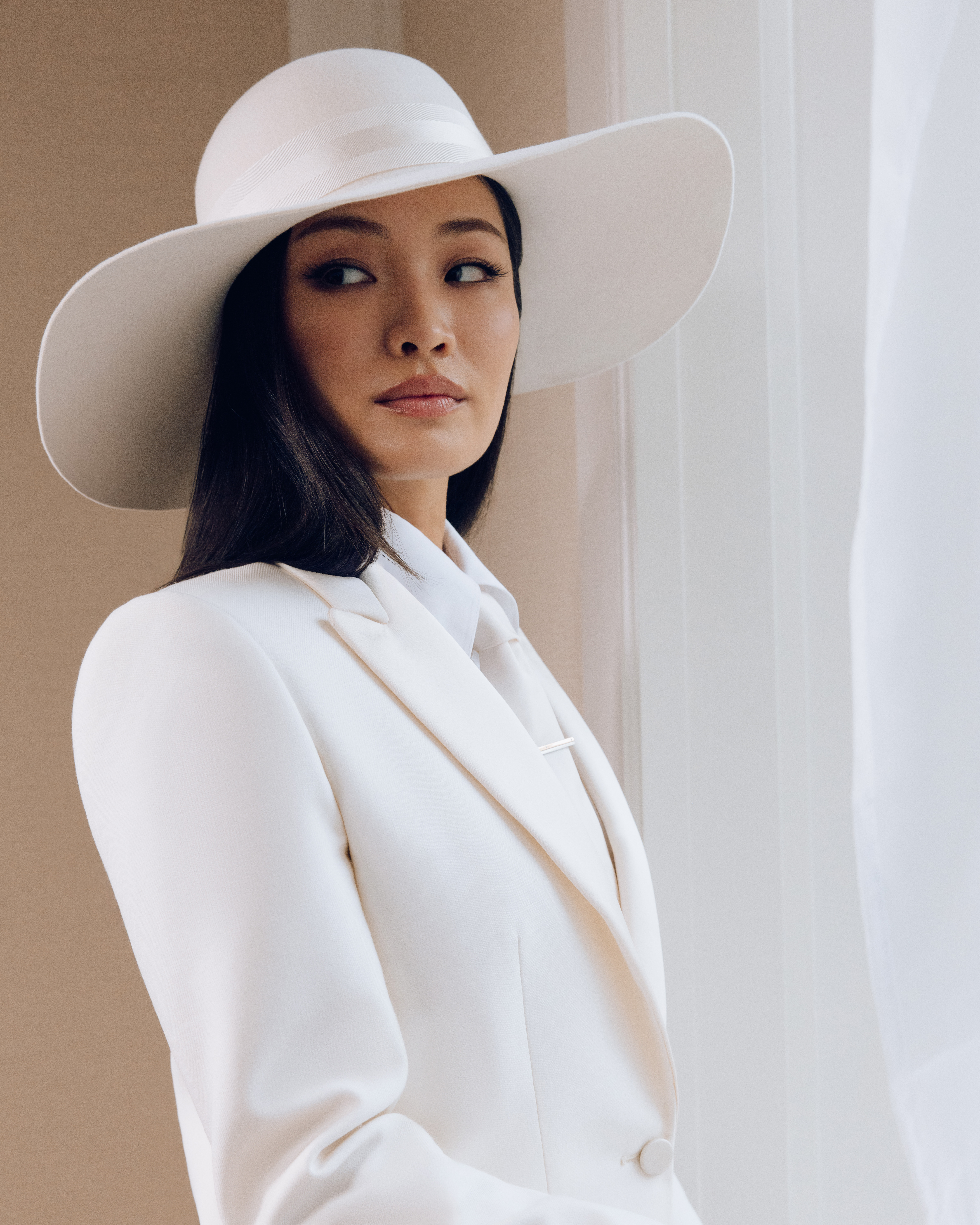 Anna Sawai getting ready for the 2025 Met Gala wearing Dior and Cartier