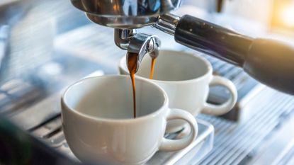 why are espresso machines so expensive? This shows a simple espresso machine making two shots of coffee in separate mugs