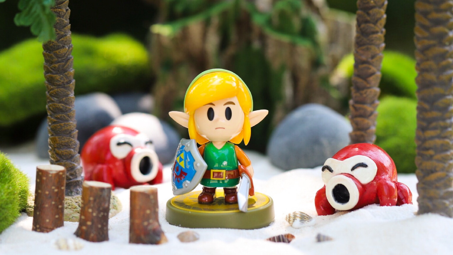 An amiibo of Link from The Legend of Zelda: Link's Awakening sits in a small diorama