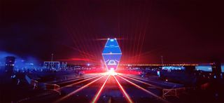A stunning blue diamond flashing with red light beaming around it using PIXERA media server systems.