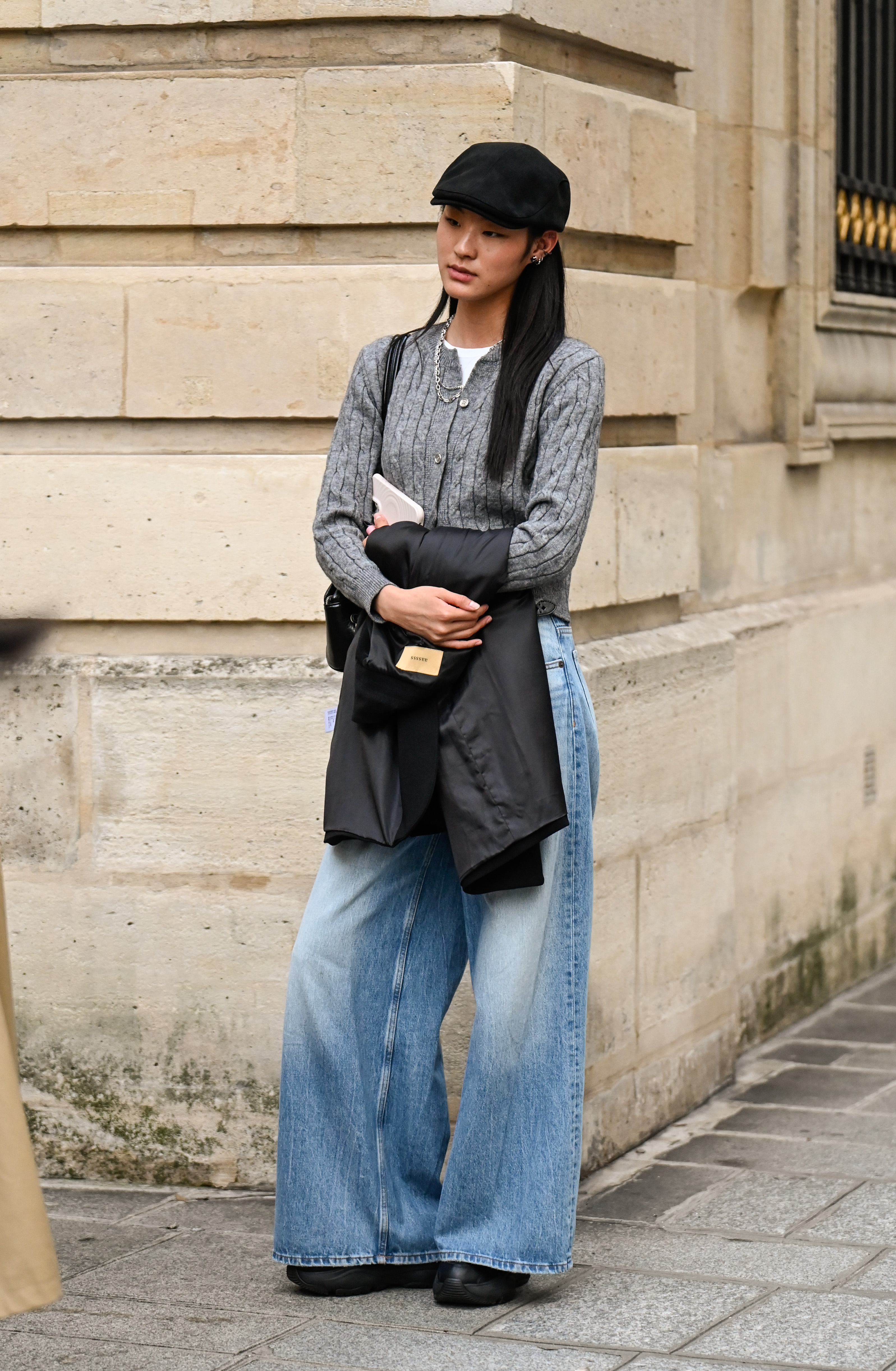 woman wearing cardigan and jeans