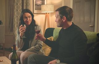 Faith and Angus enjoying wine at her home before things take a dramatic turn