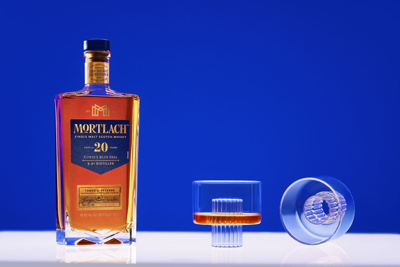 bottle of Mortlach whisky and two glasses designed by Felicia Ferrone