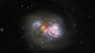 Two merging galaxies captured by the Hubble Space Telescope.