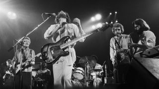 Scottish funk group Average White Band perform live on stage at the Concertgebouw in Amsterdam, Netherlands in 1976. L-R: Onnie McIntyre, Hamish Stuart, ?, Alan Gorrie, drummer Steve Ferrone, Malcolm Duncan and Roger Ball
