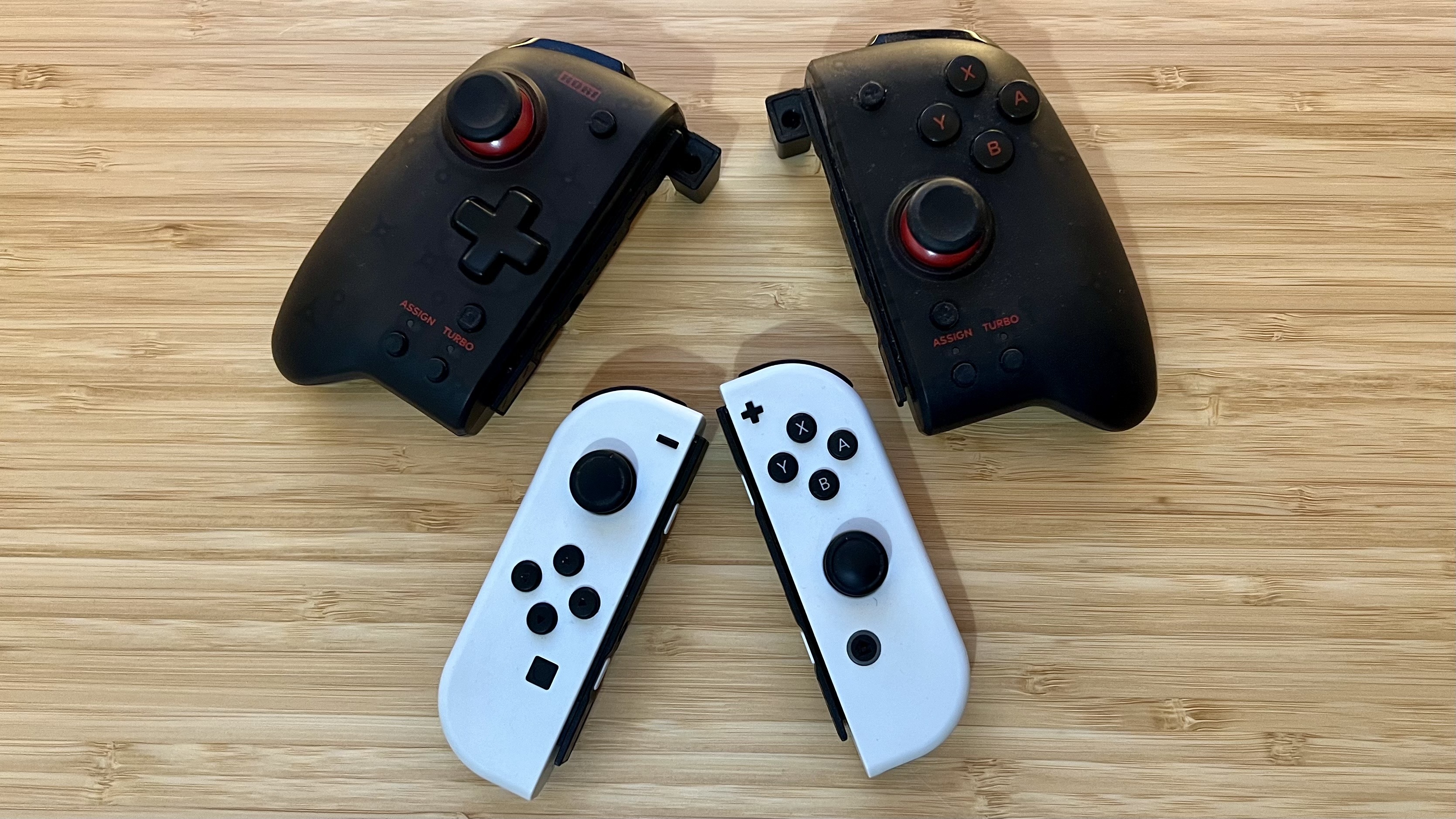 Nintendo Switch Joy-Con with Hori Split Pad Pro on a wooden desk