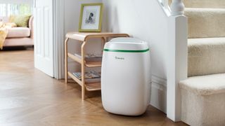 Meaco dehumidifier in hallway in front of shelving