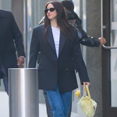 Shailene Woodley wearing jeans and loafers