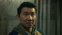 Shang-Chi in an elevator looking for his sister. 