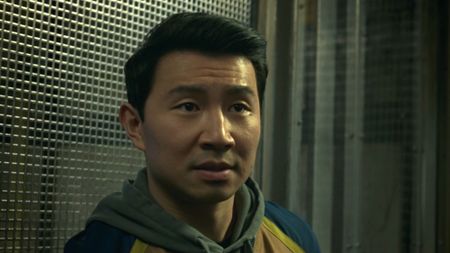 Shang-Chi in an elevator looking for his sister. 