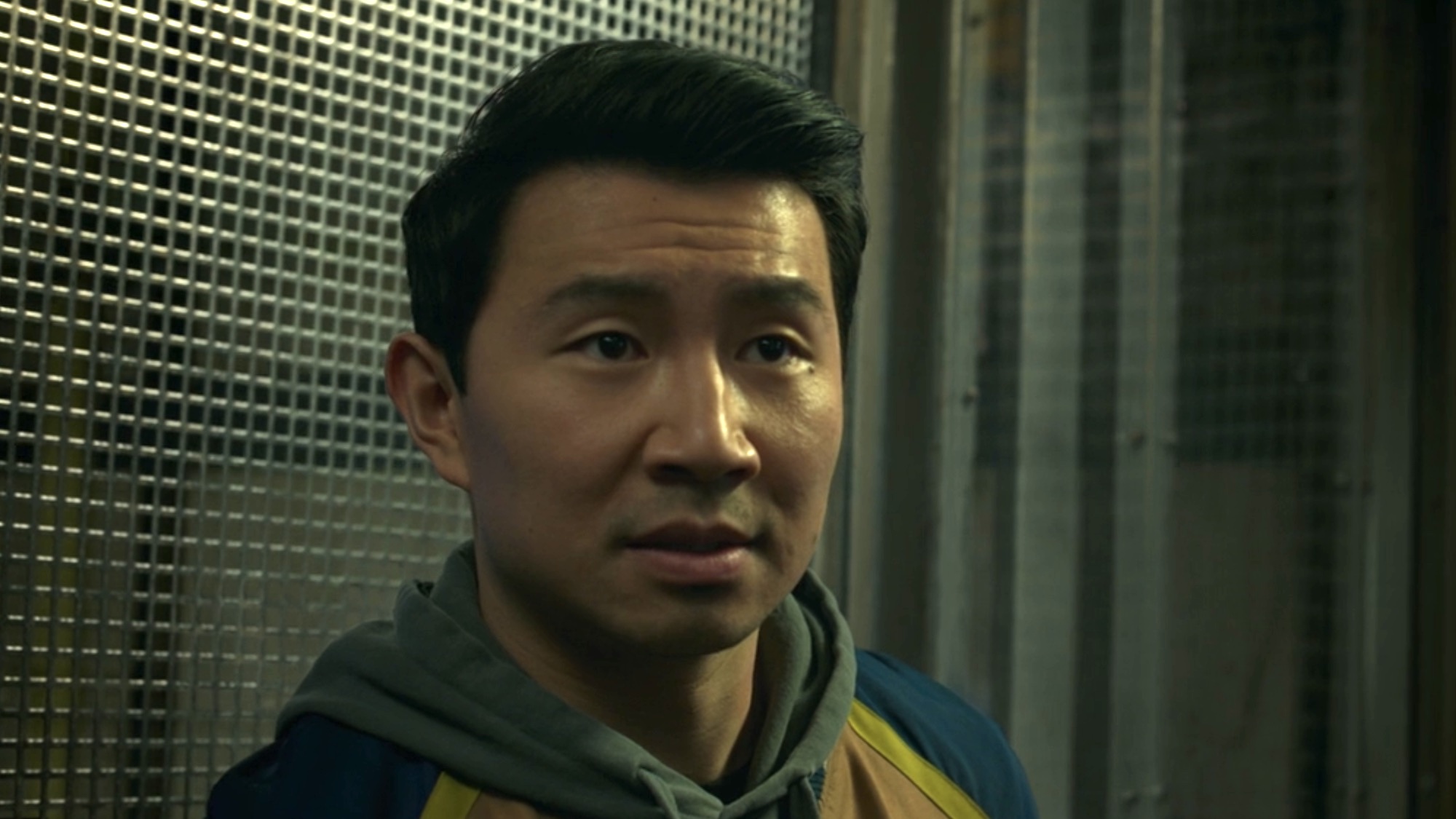Shang-Chi in an elevator looking for his sister. 
