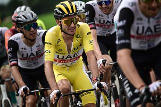 UAE Team Emirates British rider Adam Yates wearing the overall leaders yellow jersey cycles with the pack of riders during the 4th stage of the 110th edition of the Tour de France cycling race 182 km between Dax and Nogaro in southwestern France on July 4 2023 Photo by Marco BERTORELLO AFP Photo by MARCO BERTORELLOAFP via Getty Images