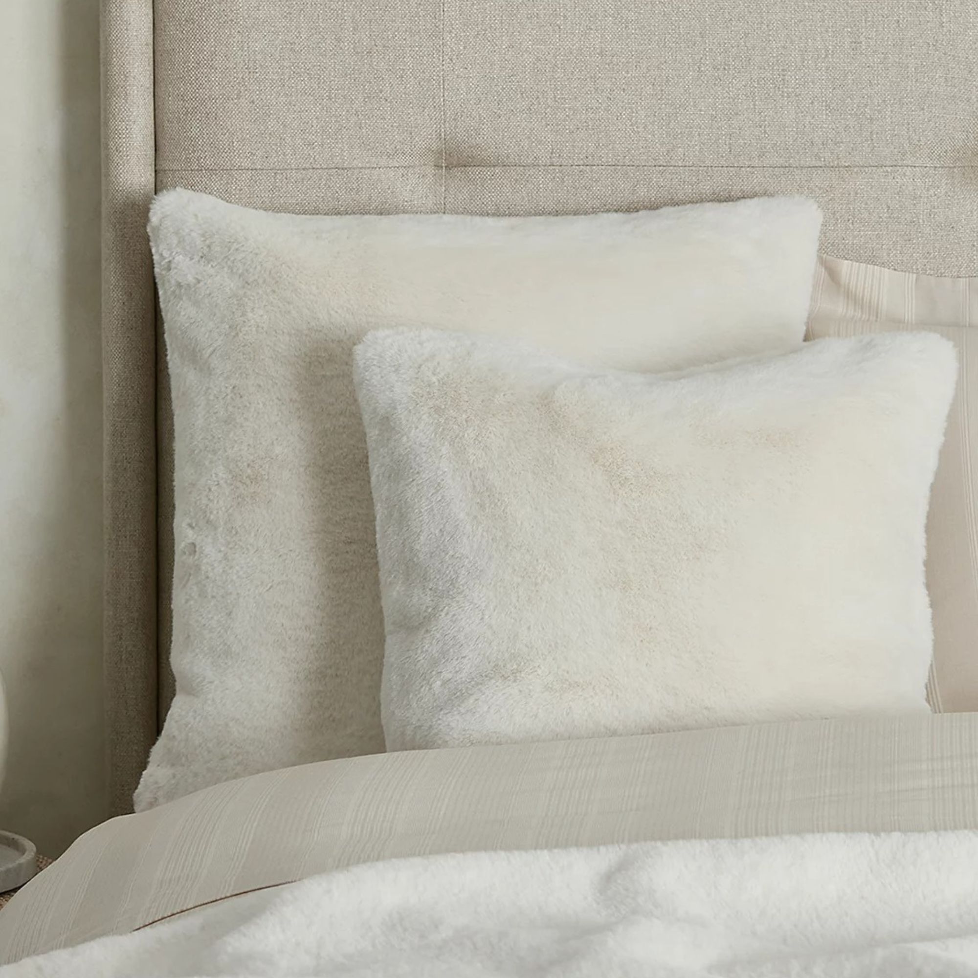 White fur cushions