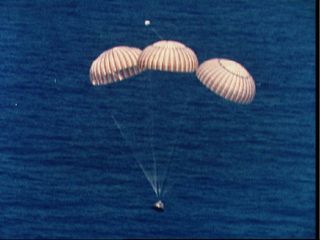 Apollo capsule nears splashdown at end of Apollo-Soyuz mission.