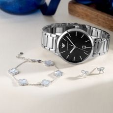 Silver bracelet, watch and earrings sold at Beaverbrooks