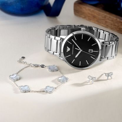 Silver bracelet, watch and earrings sold at Beaverbrooks