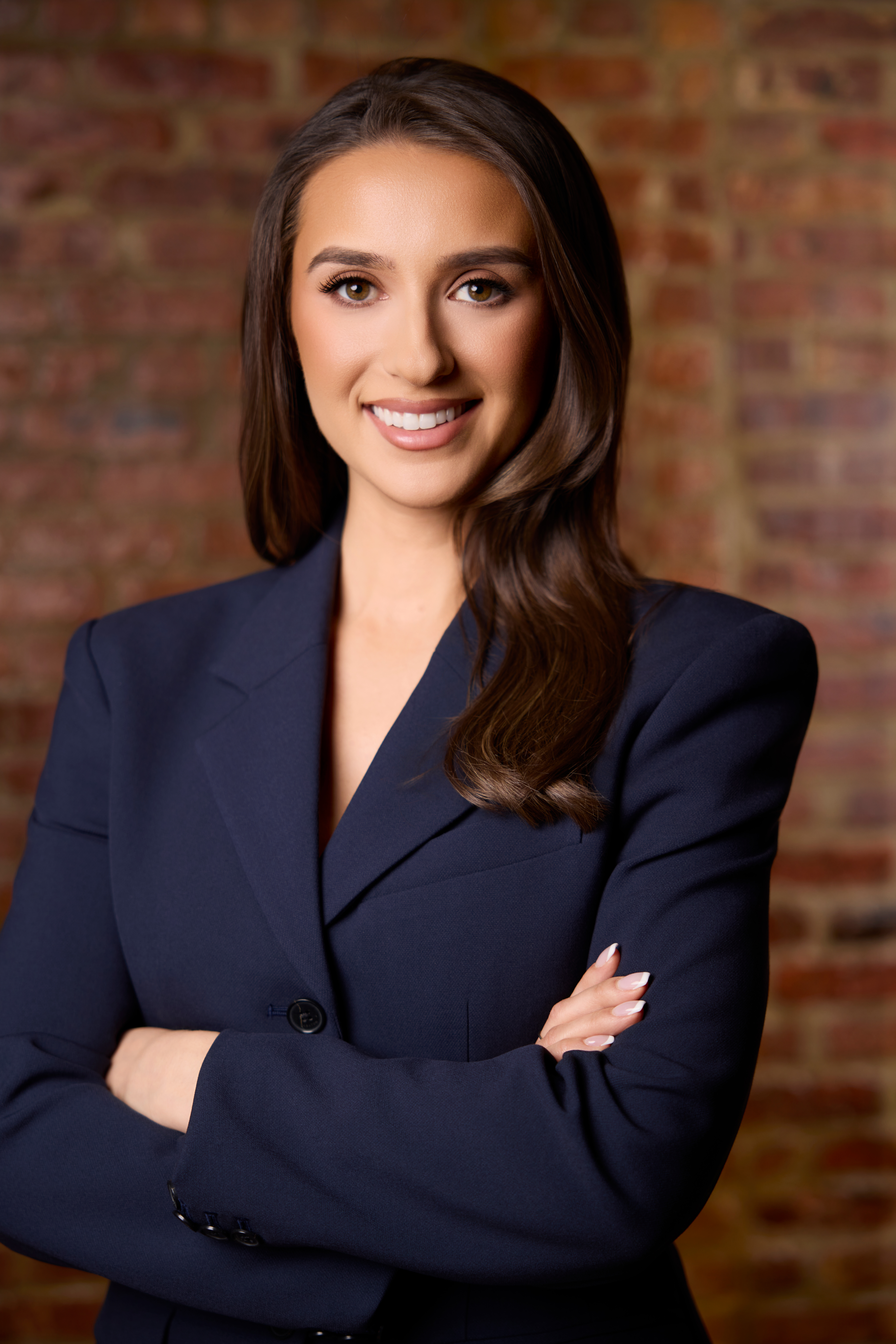 A woman, Kara Kowalski, poses for a headshot.