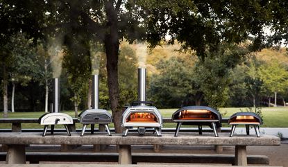 a selection of Ooni pizza ovens on a table