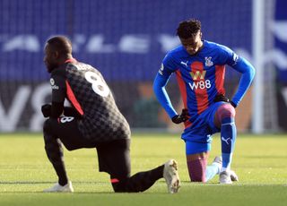 Crystal Palace's Wilfried Zaha, right, says he will stop taking the knee before matches