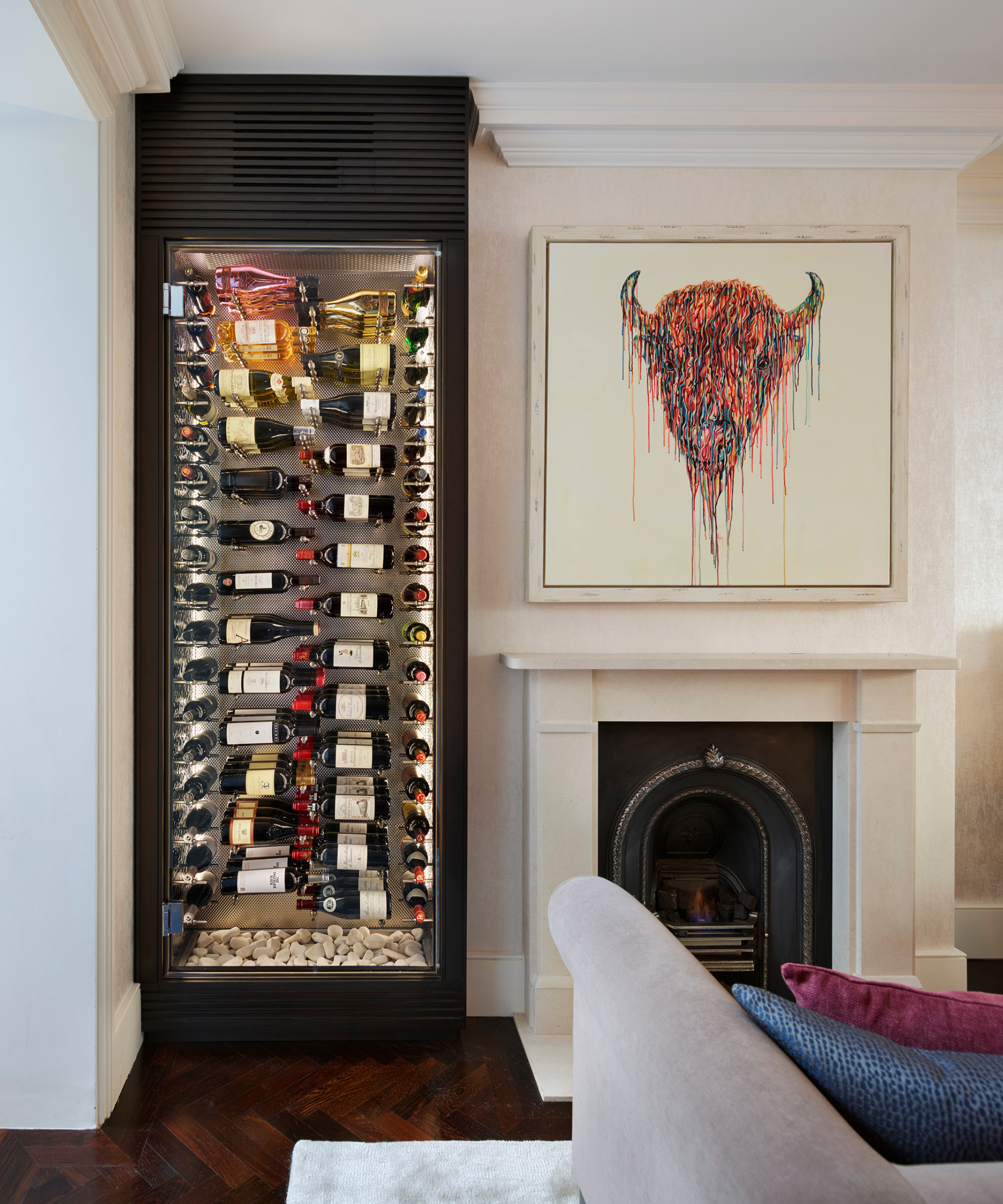 Living room alcove with a wine cabinet next to fireplace