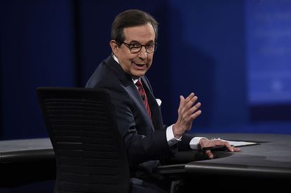 Moderator Chris Wallace ask for quiet from the audience during the final presidential debate at the Thomas & Mack Center on the campus of the University of Las Vegas in Las Vegas, Nevada on O