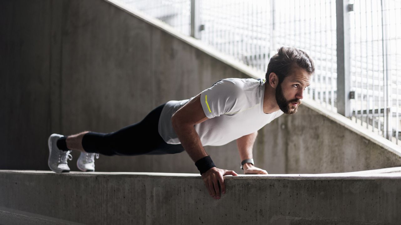 Man holding a plank