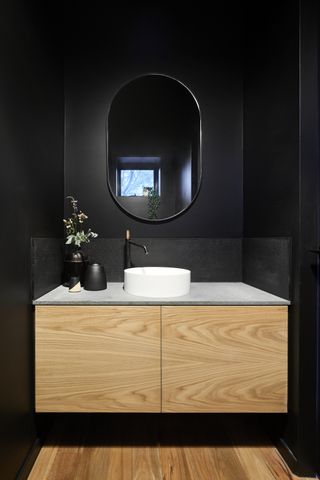 A black bathroom without visual clutter