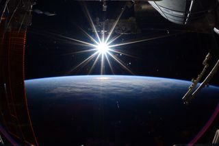 NASA astronaut Terry Virts captured this view of the sun over Earth on his last day in space as he prepared to leave the International Space Station on June 11, 2015. It is the last photo he took before returning to Earth that day.