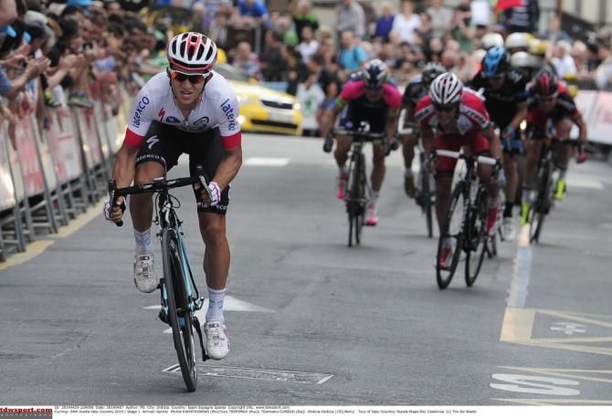 Michal Kwiatkowski rides away to third