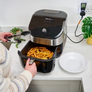 air fryer cooking chips on countertop