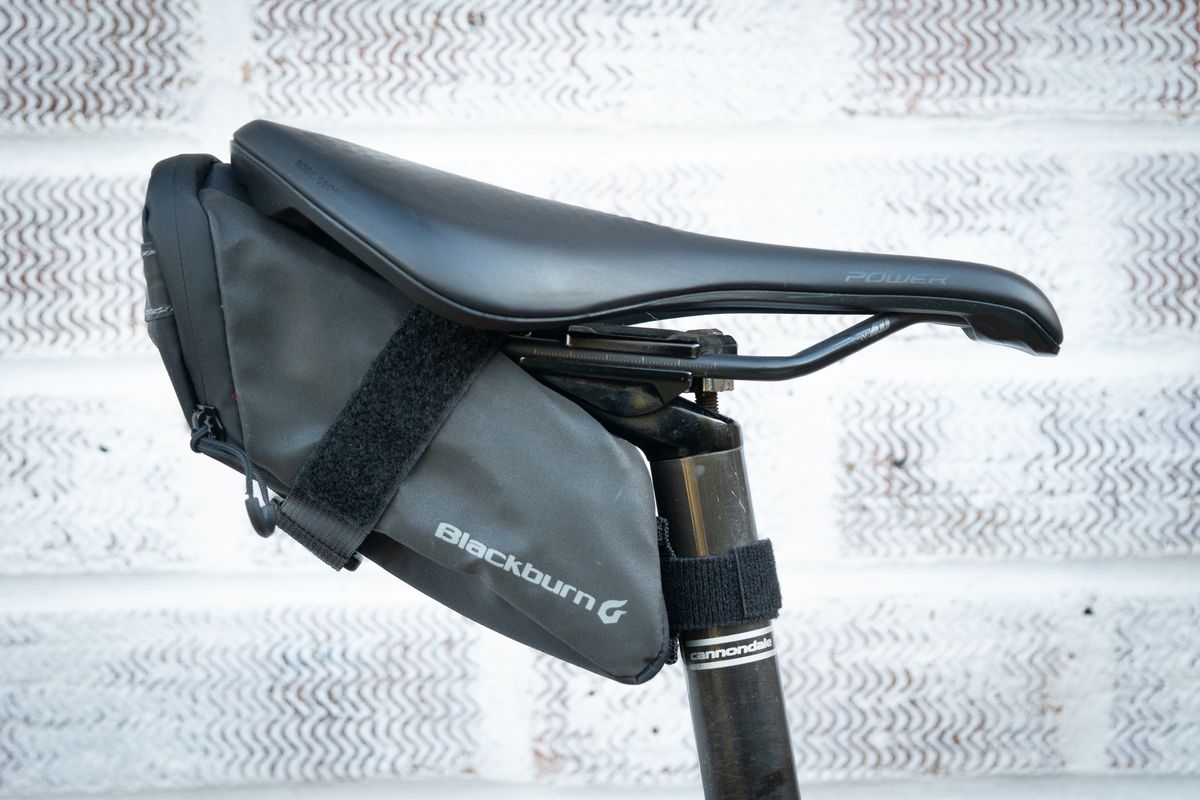 Blackburn Grid saddle bag in black attached to saddle rails and seatpost