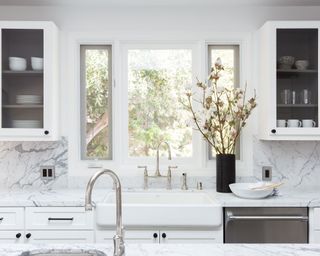White kitchen, view out of windows above kitchen sink