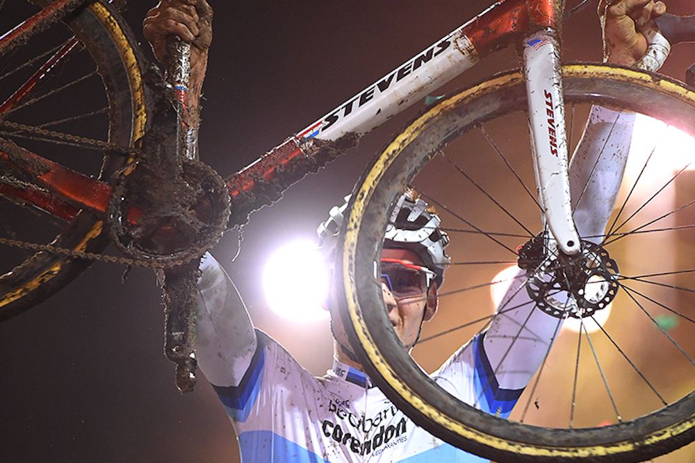 Mathieu van der Poel lifts his bike aloft after winning Superprestige Diegem