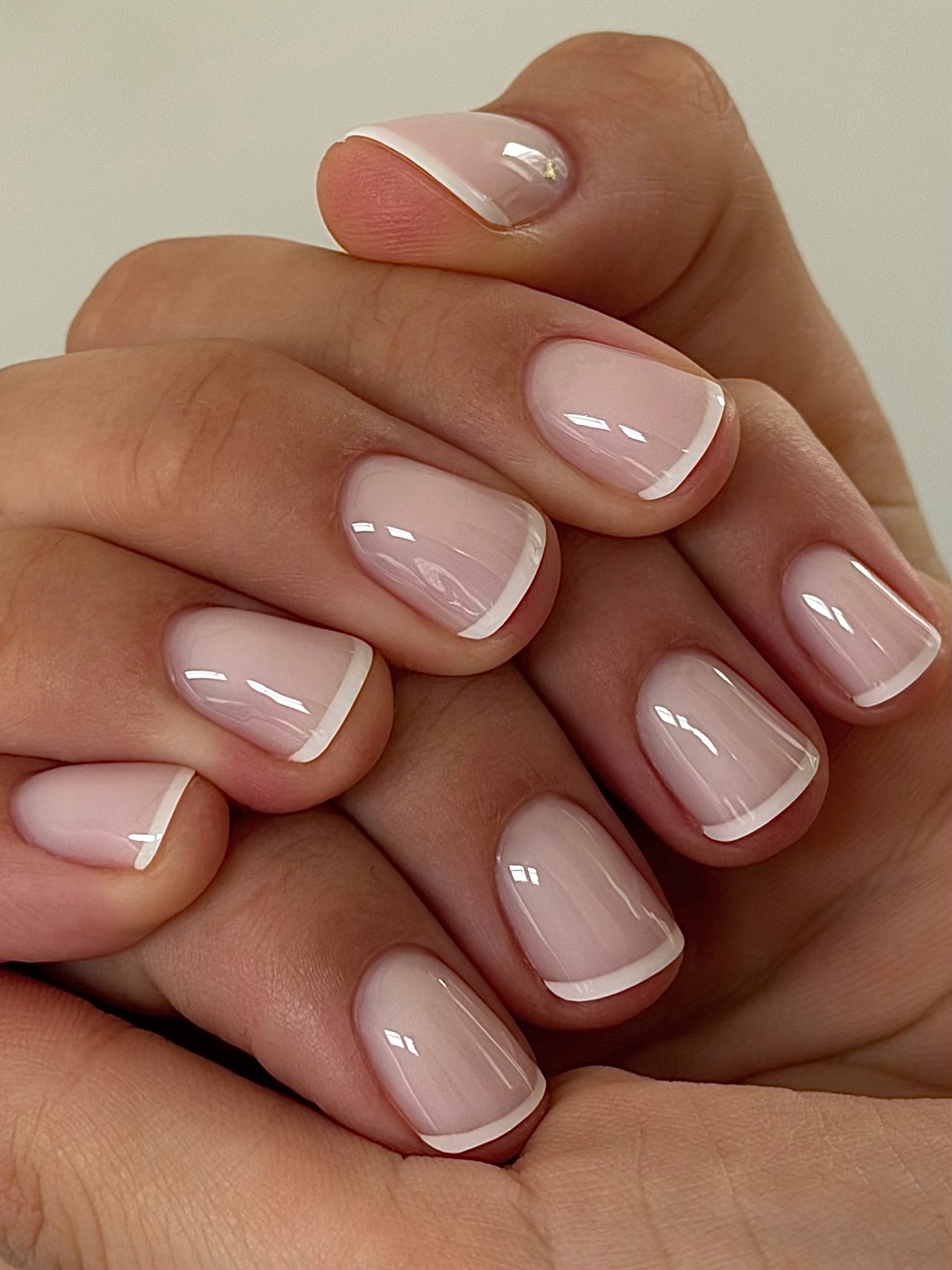 A classic French manicure on short nails