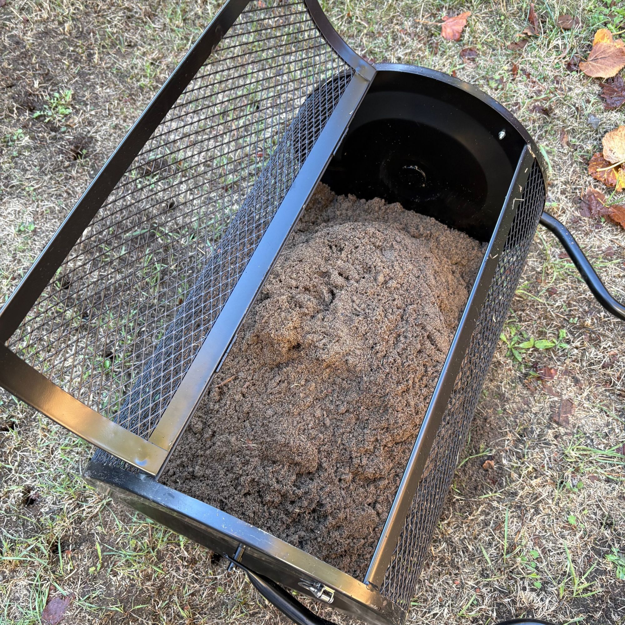 Outsunny Compost Spreader basket filled with lawn seeding soil