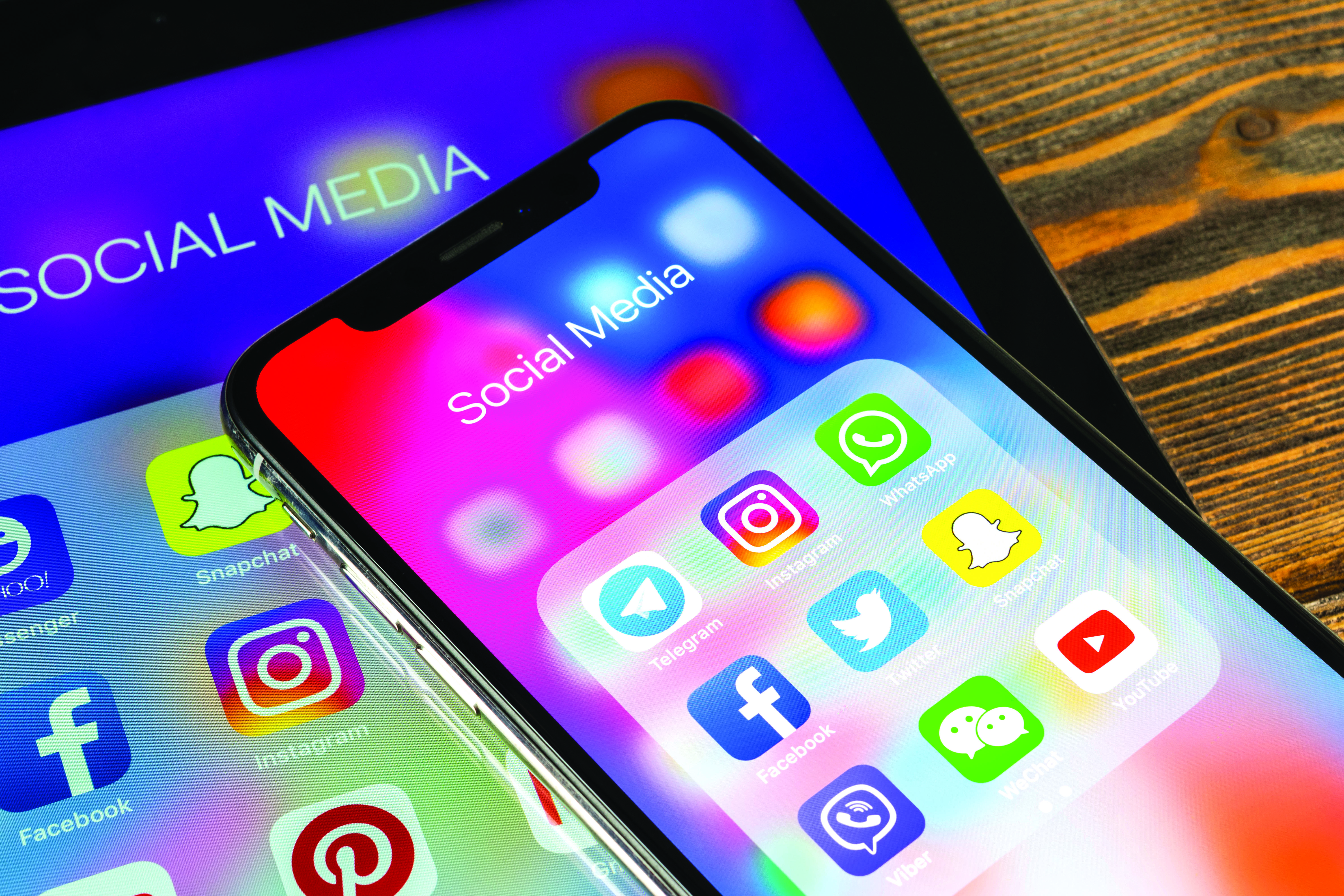 Phone turned on and displaying different social media apps