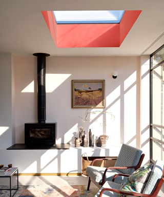 A living room painted in F&B Tailor Tack No.302 with a sky light painted in Bamboozle No.304