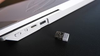 The ROG Falchion RX gaming keyboard in white set up on a desk.