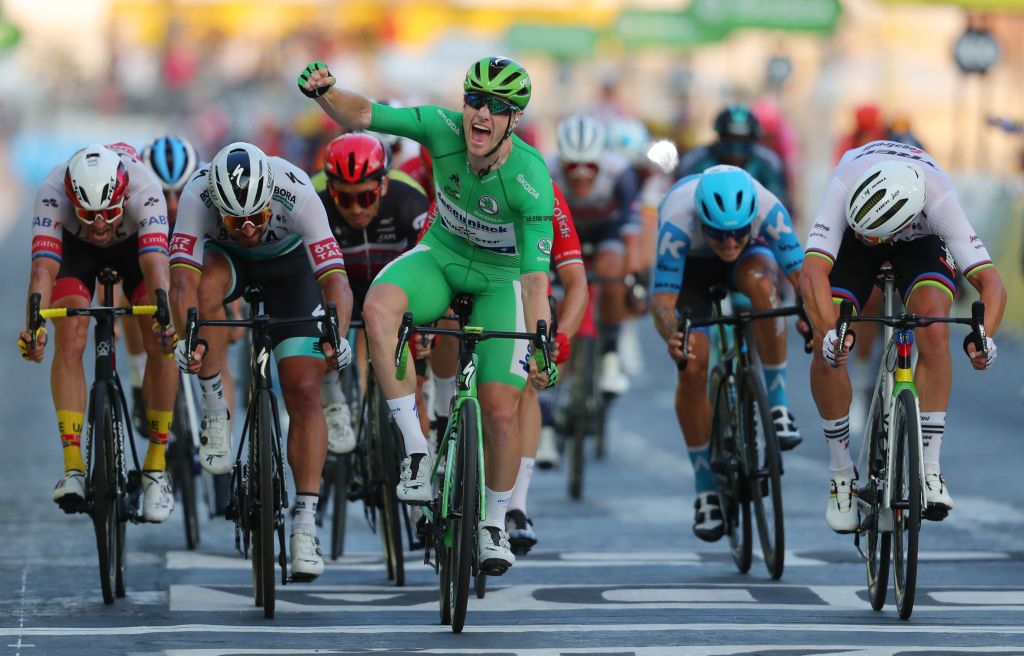 Stage winner Team Deceuninck rider Irelands Sam Bennett wearing the best sprinters green jersey celebrates as he crosses the finish line during the 21st and last stage of the 107th edition of the Tour de France cycling race 122 km between ManteslaJolie and Champs Elysees Paris on September 20 2020 Photo by Thibault Camus various sources AFP Photo by THIBAULT CAMUSAFP via Getty Images