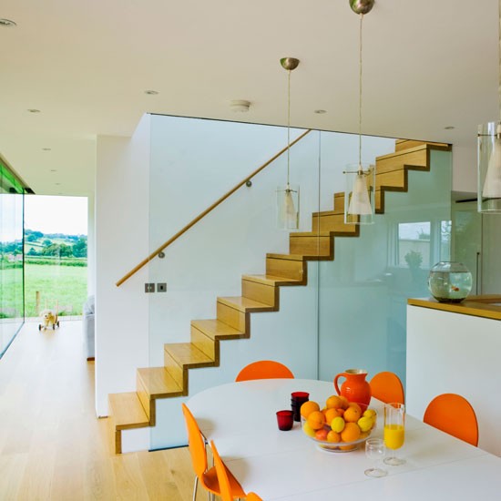 living room with white dinning table fruits upstairs