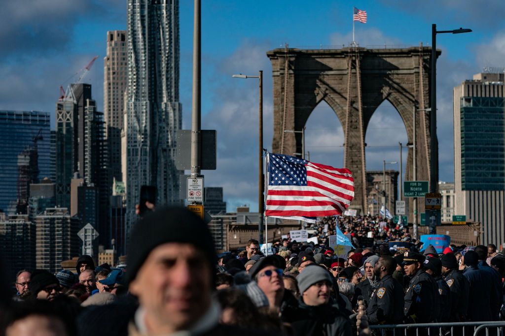 People participate in a march against anti-Semitism.