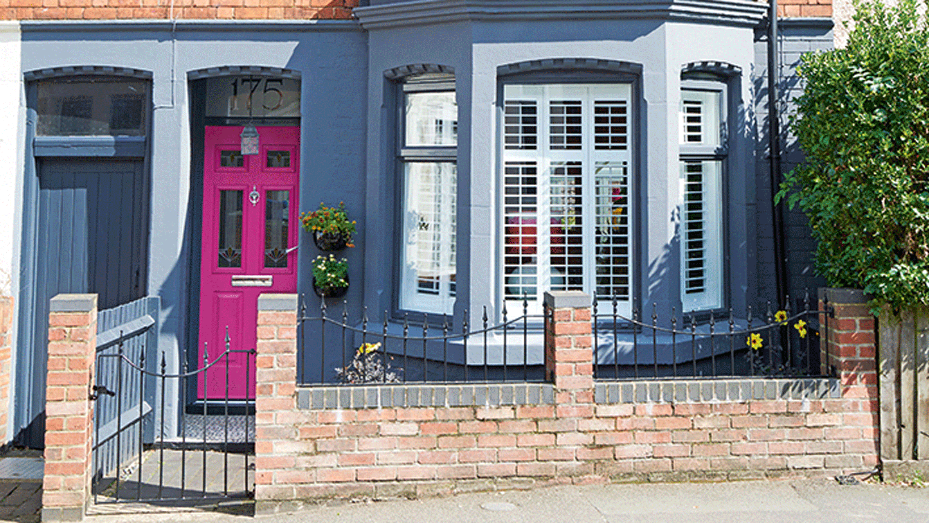 Fusica pink front door with navy house front