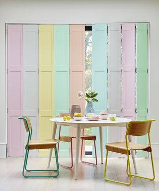 Pastel rainbow shutters in dining area