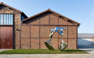 Pelvis house with brick wall and grass