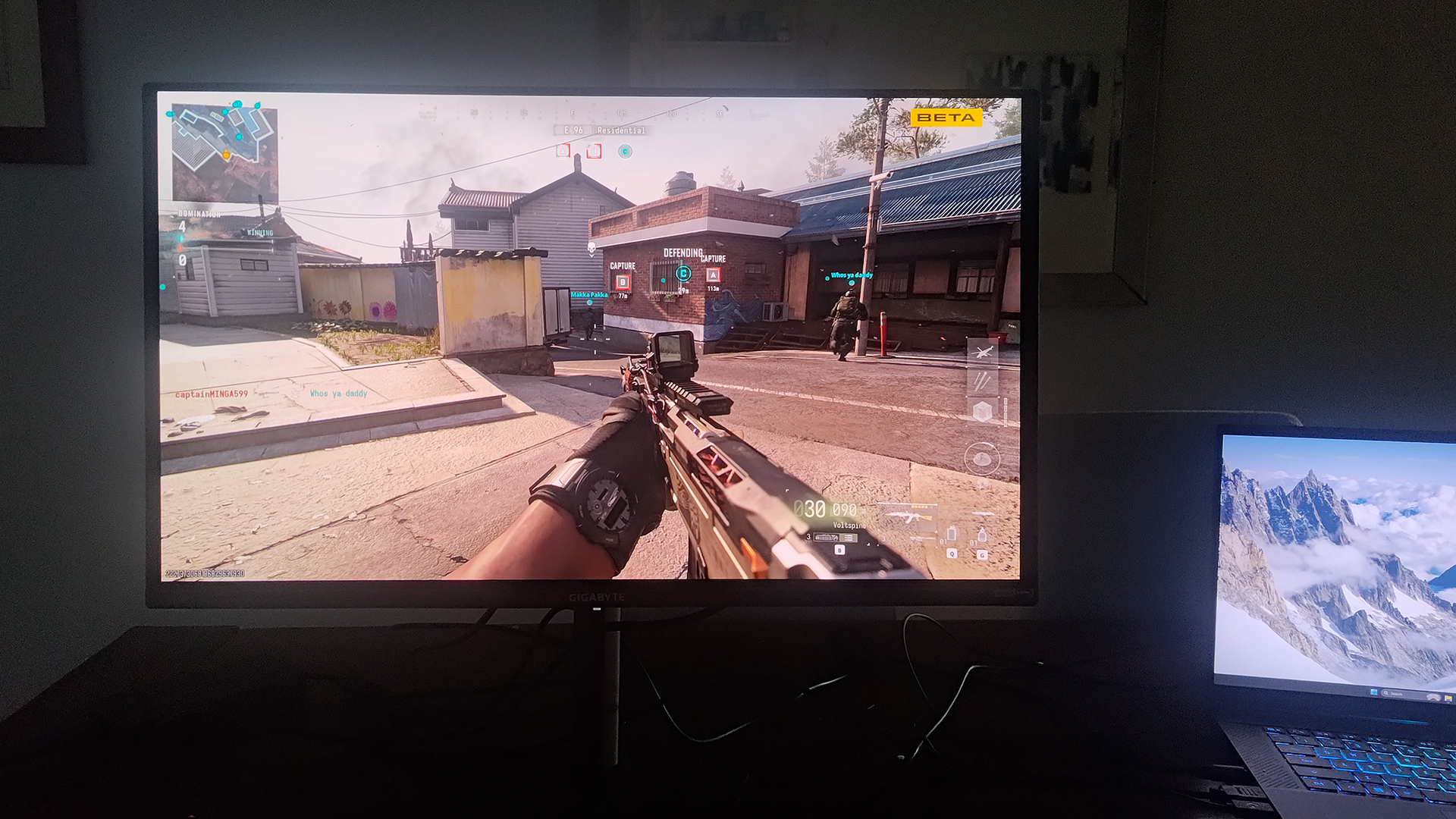 Gigabyte GO27Q24A being used in a dark room