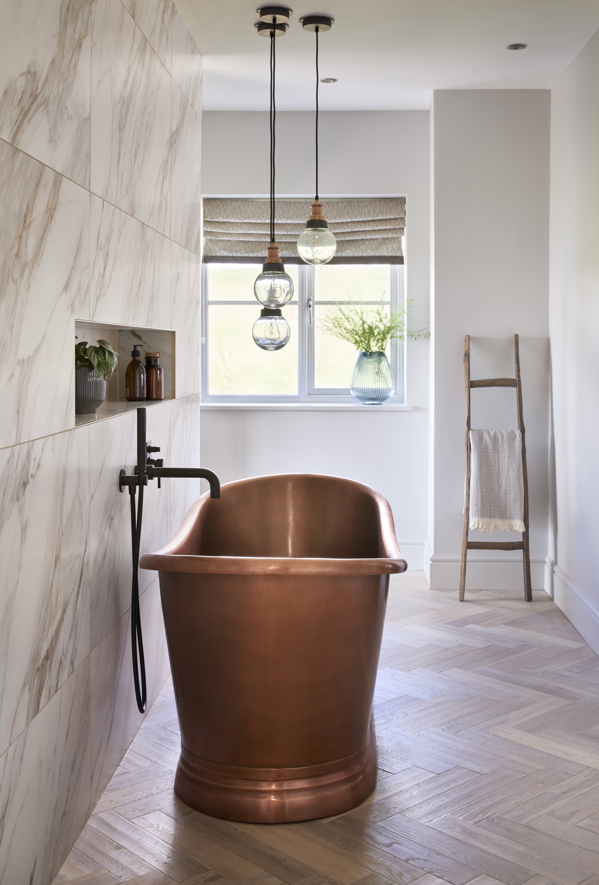 white bathroom with copper freestanding bath by BC Designs