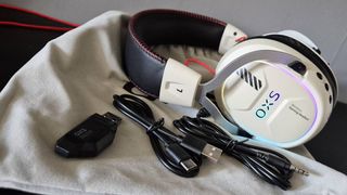 Photo taken by writer Rosalie Newcombe of the OXS Storm G2 wireless gaming headset and what's included in its box.